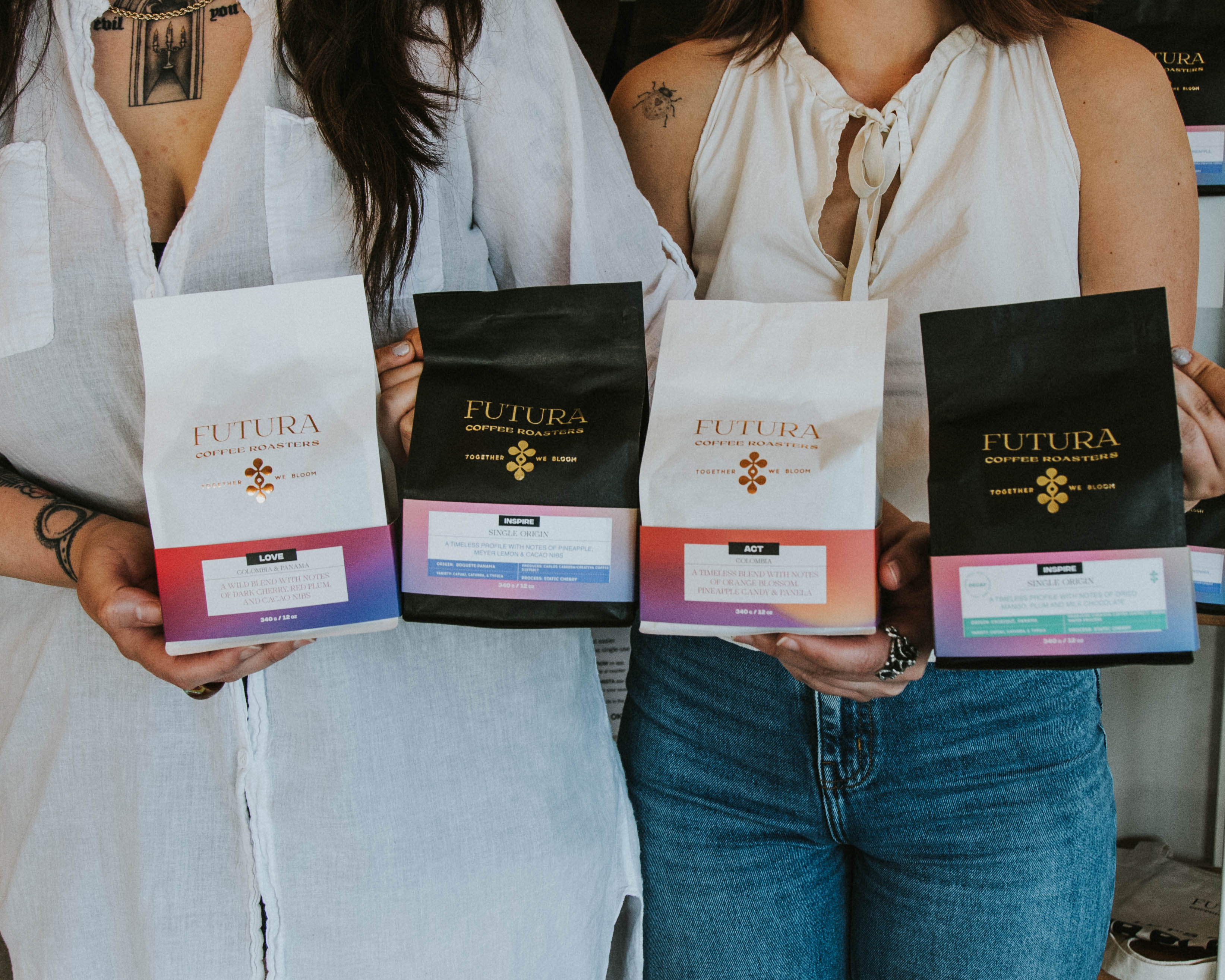 Banner with multiple futura coffee roasters offerings being held by two people